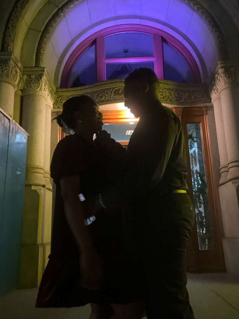 Valerie and Mitchell walking hand in hand